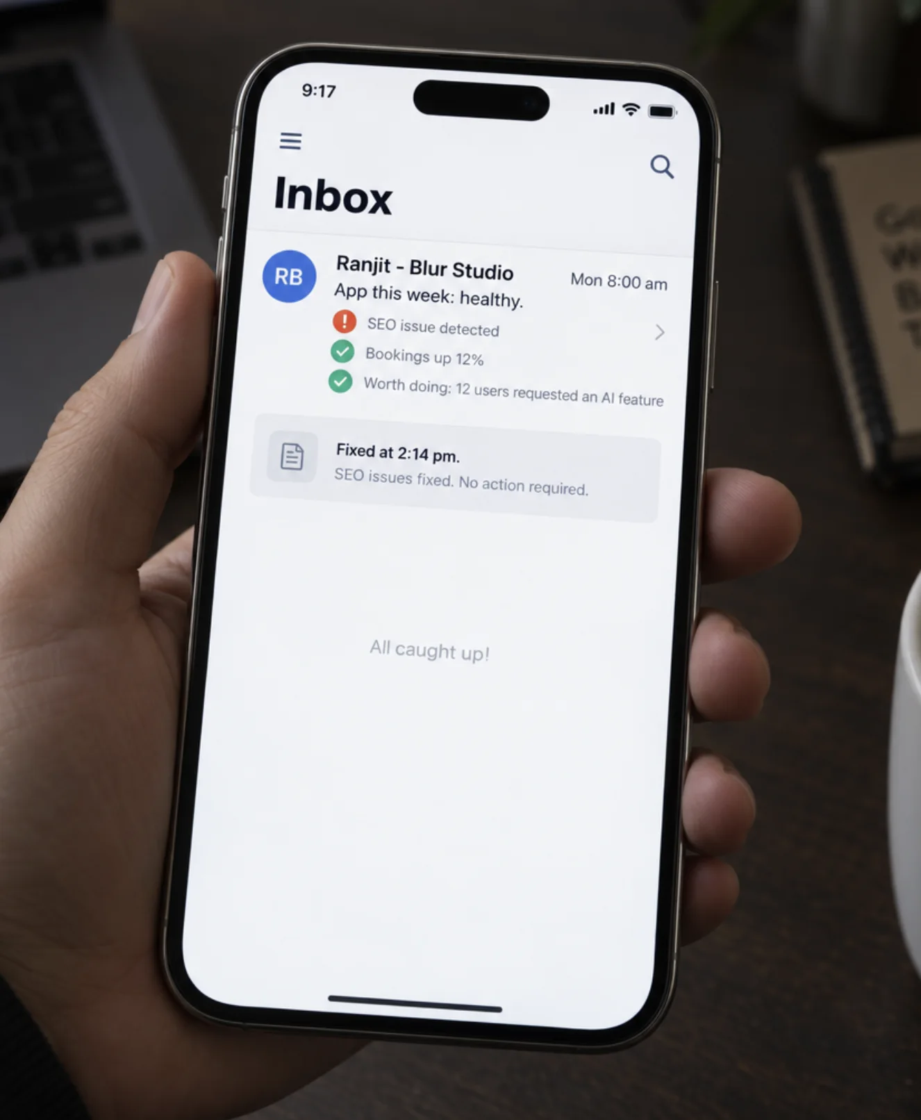 A phone showing the weekly report email from Ranjit: app healthy, an SEO issue found and fixed, bookings up 12%, and the inbox all caught up.